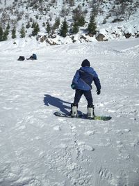 Full length of child in snow