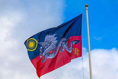 Low angle view of flag against sky