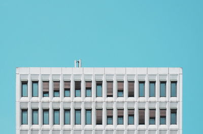 Bird on building against clear sky