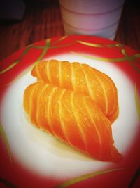 Close-up of orange slice in plate