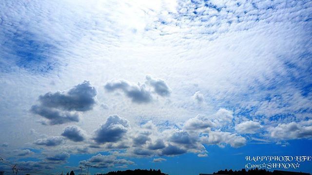 sky, cloud - sky, blue, low angle view, beauty in nature, scenics, tranquility, cloudy, cloud, nature, tranquil scene, weather, outdoors, cloudscape, no people, day, white color, idyllic, mountain, silhouette