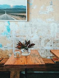 Potted plant on table by window