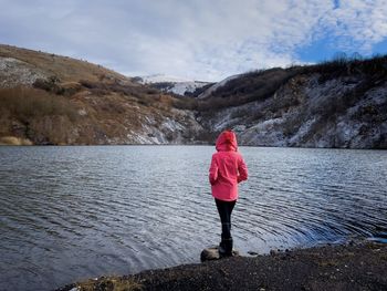 Rear view of woman walking on mountain