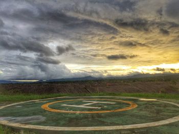 Scenic view of landscape against cloudy sky