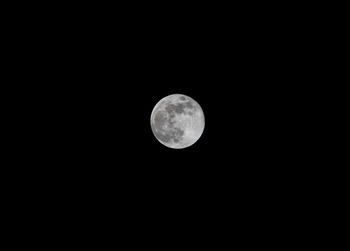 Low angle view of full moon in sky