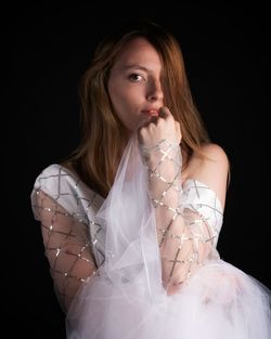 Portrait of young woman wearing wedding dress