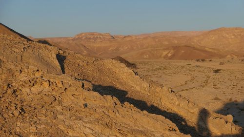 Scenic view of desert against clear sky