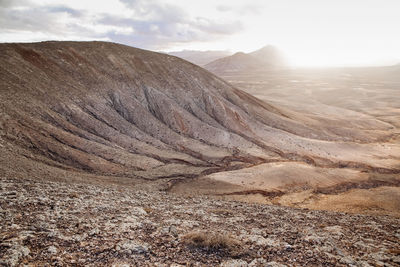 Scenic view of sunset in the mountains with the desert volcanic landscape, fuerteventura island