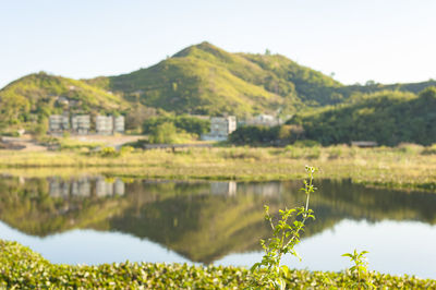 Scenic view of lake and mountains against sky