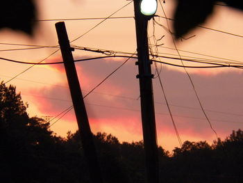 Low angle view of silhouette trees against sky during sunset