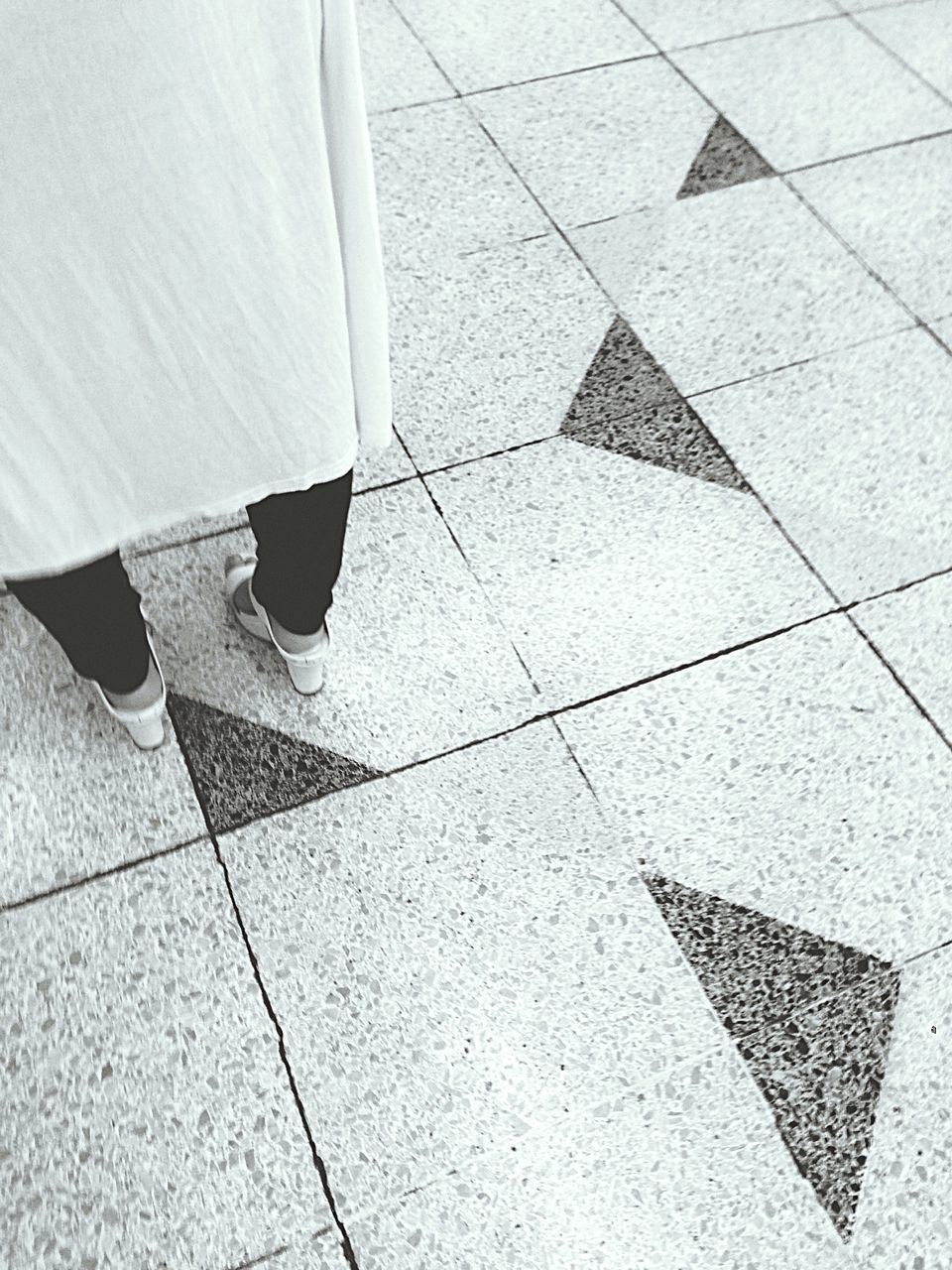 tiled floor, pattern, high angle view, tile, paving stone, cobblestone, flooring, low section, shadow, design, textured, full frame, sunlight, person, day, footpath, indoors, shoe, pavement, sidewalk