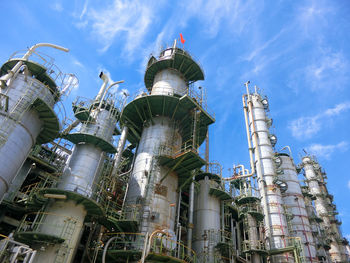 Low angle view of smoke stack against sky