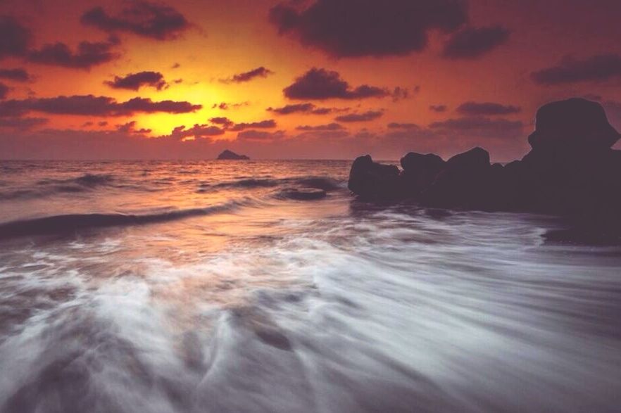 water, sunset, sea, scenics, sky, beauty in nature, horizon over water, tranquil scene, wave, tranquility, cloud - sky, nature, beach, orange color, idyllic, shore, surf, rock - object, dramatic sky, motion