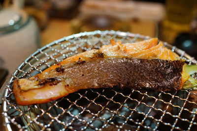 Close-up of grilled salmon on barbecue grill