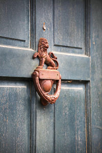Close-up of rusty door knocker