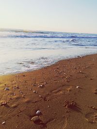 Scenic view of beach against clear sky