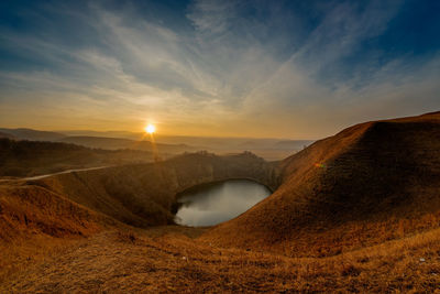 Scenic view of landscape against sky during sunset