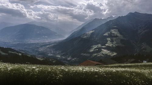 Scenic view of landscape and mountains against sky
