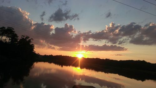 Scenic view of lake at sunset