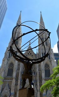 Low angle view of statue against building