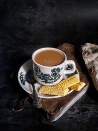 High angle view of coffee cup on table