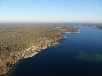 Aerial view of sea against clear sky