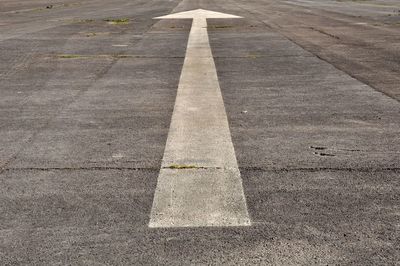 High angle view of arrow symbol on road