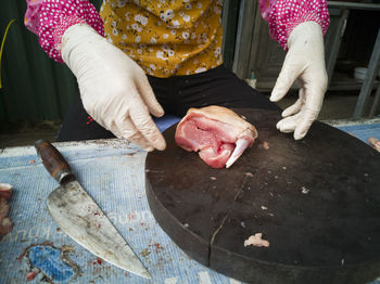 Midsection of woman preparing food