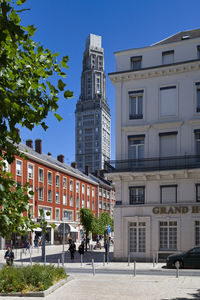 Low angle view of buildings against clear blue sky