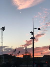 Silhouette of street lights at sunset