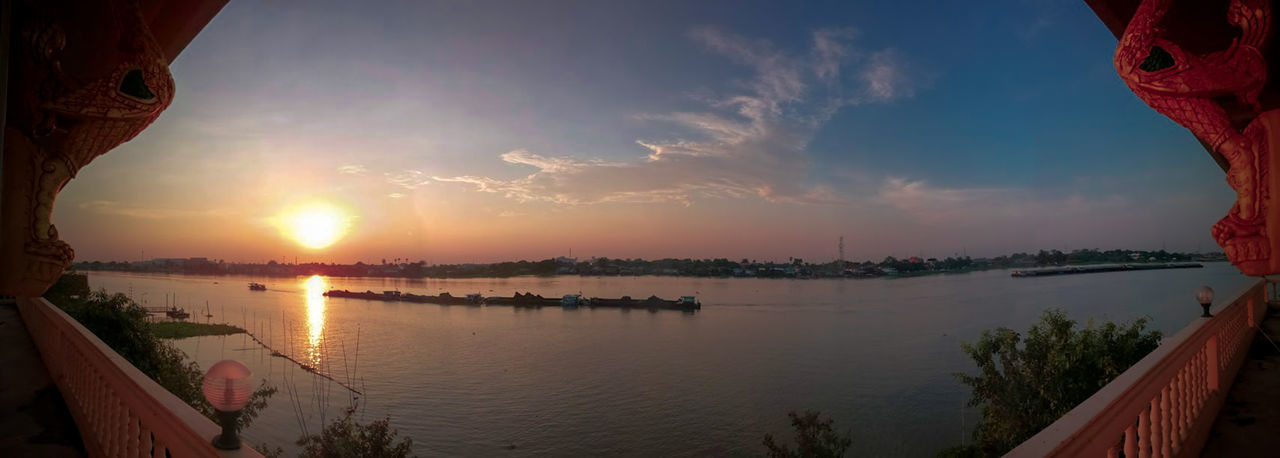 PANORAMIC VIEW OF LAKE DURING SUNSET