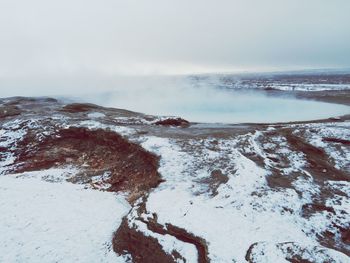 Scenic view of snow covered mountain against sky