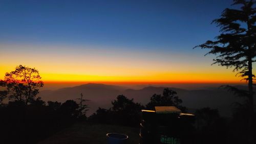 Scenic view of silhouette landscape against sky during sunset