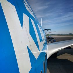 Low angle view of airplane against sky