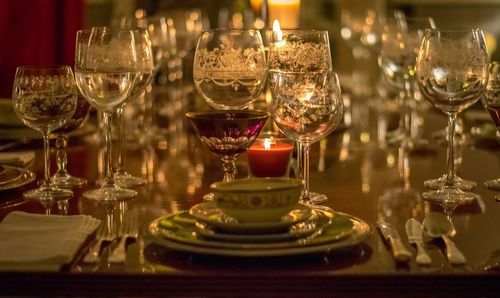 Close-up of wine glasses on table