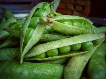 Close-up of green chili peppers at market stall