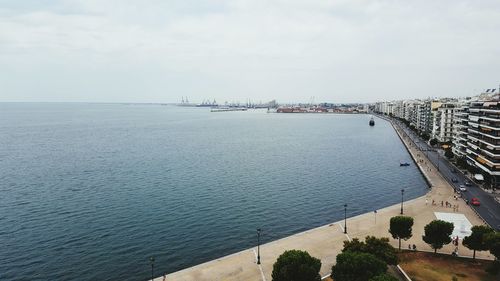 City by sea against sky