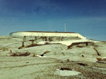 Abandoned sand on beach against clear sky