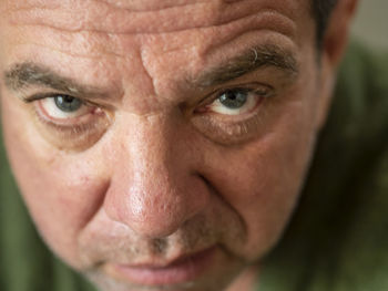 Close-up portrait of angry mature man