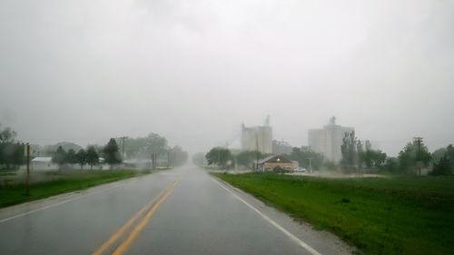 Road in city against sky