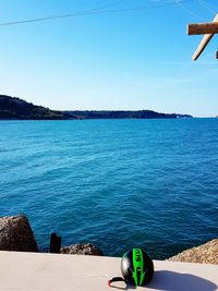 Scenic view of sea against clear blue sky