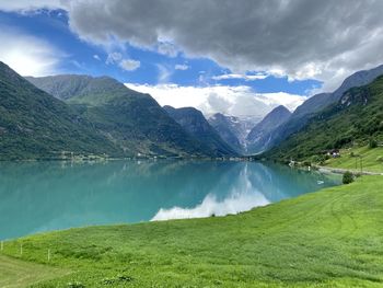 Panoramic view of lake and mountains against sky