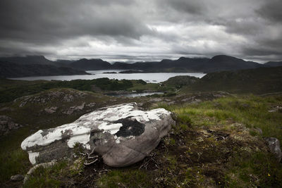 Scenic view of rocks on land against sky