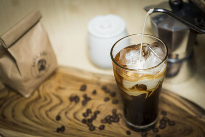 High angle view of coffee in glass on table