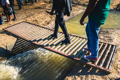 Low section of people walking on water