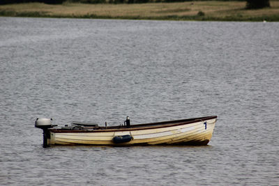 Boat moored in lake