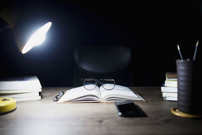 Close-up of electric lamp on table