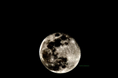 Full moon over black background