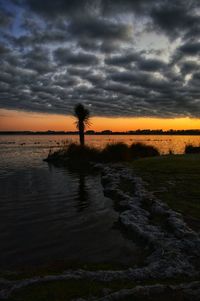 Scenic view of sea against cloudy sky