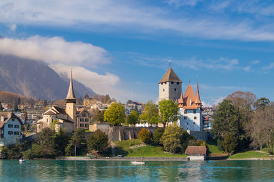  landscape of thun with historical buildings and blue sky background and have lake thun located 